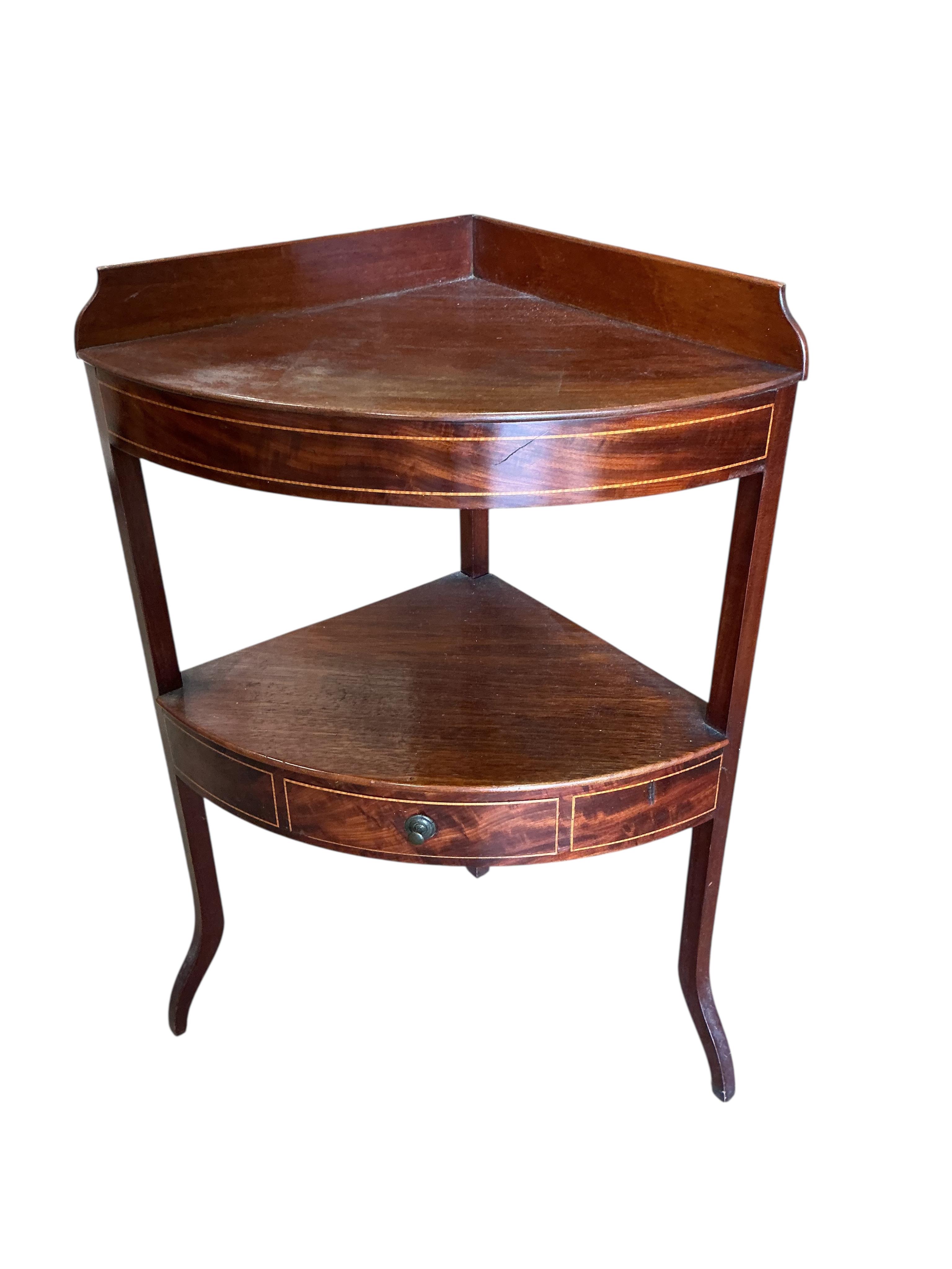 A George III mahogany bow front corner washstand, pot cupboard and an Edwardian plant stand